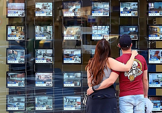 Young couple looking at properties to rent.