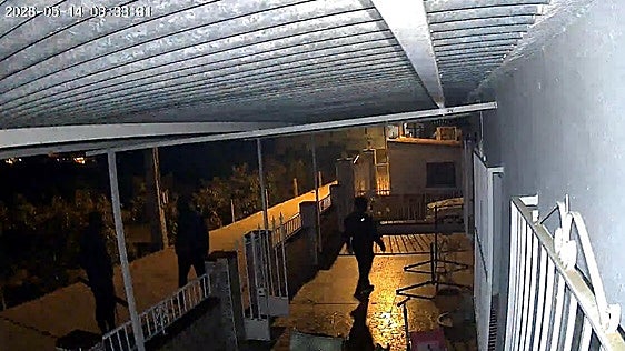 Image of the three hooded men captured by the security camera of one of the houses raided in Almayate Alto.