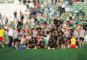 The Torremolinos players celebrate salvation with the travelling fans at El Maulí.
