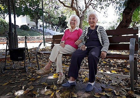 Pepa and Isidora sitting in a park near the day centre for the elderly in Malaga's Puerto de la Torre district.