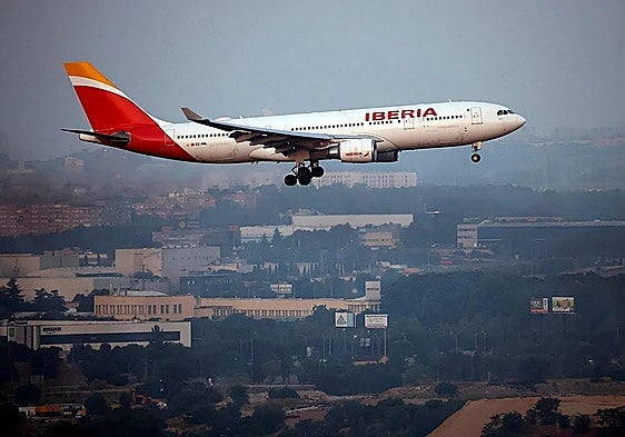 An Iberia plane lands at Adolfo Suárez Madrid-Barajas Airport.
