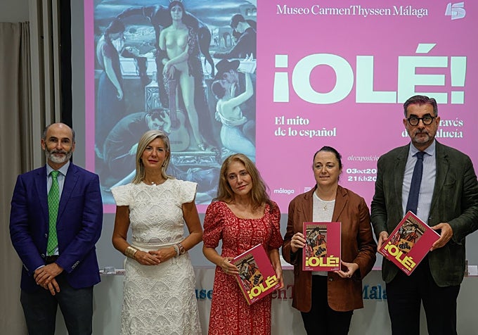 Officials pose at the exhibition opening.