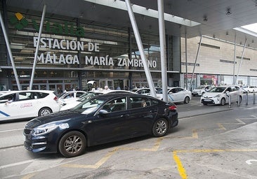 A private hire car drives past the taxi rank at María Zambrano station in Malaga.