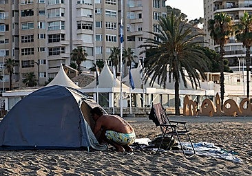 Around 20 homeless people live in tents and makeshift shelters at Malaga's La Malagueta beach