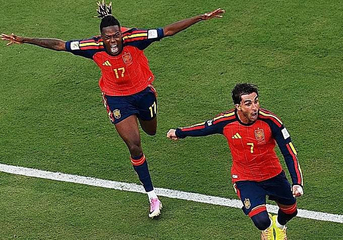 Ferran Torres, right, celebrates scoring the winning goal.