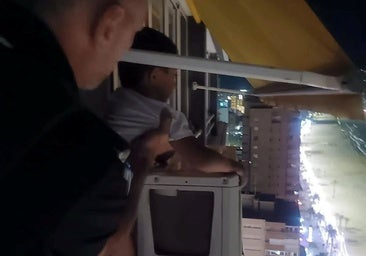 The moment the police officer risked his own life to grab hold of the boy.