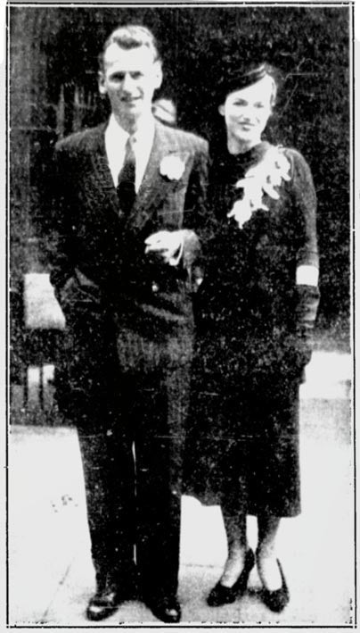 With her husband.