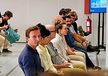 The accused activists, seated in the dock.