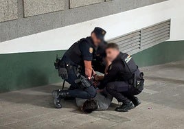 The National Police in Malaga arresting the suspect.