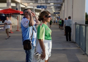 Two people watching the eclipse in Malaga.