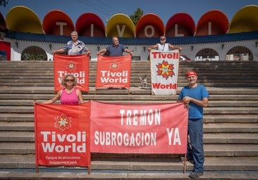 Former Tivoli staff holding banners calling for the park to reopen.