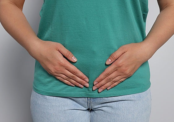 A woman is suffering from severe menopausal pain.