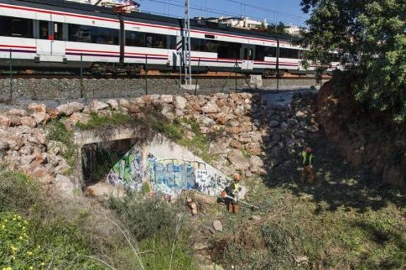 Workers in the stream bed.