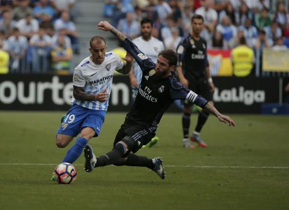 Sandro skips past Sergio Ramos on Sunday.