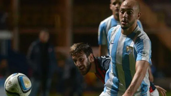 Facundo Quignón challenges Malaga's Nordin Amrabat in a friendly two summers ago.