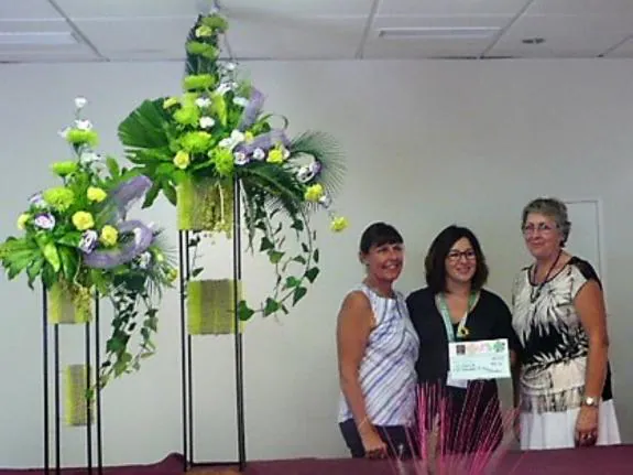 Esther Ráez of Cudeca with members of the Floral Art Society.