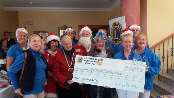 The La Cala Lions present cheque to Ruth Mokler of The Royal British Legion.