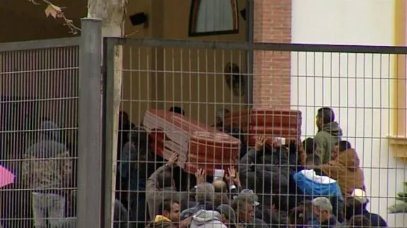 The two coffins at the funeral on Sunday.