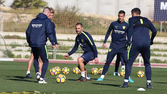 Lacen (centre) training with the first team on Saturday.
