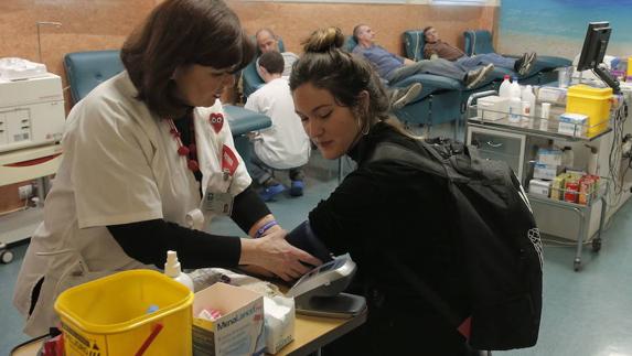 A woman gives blood in a file photo.