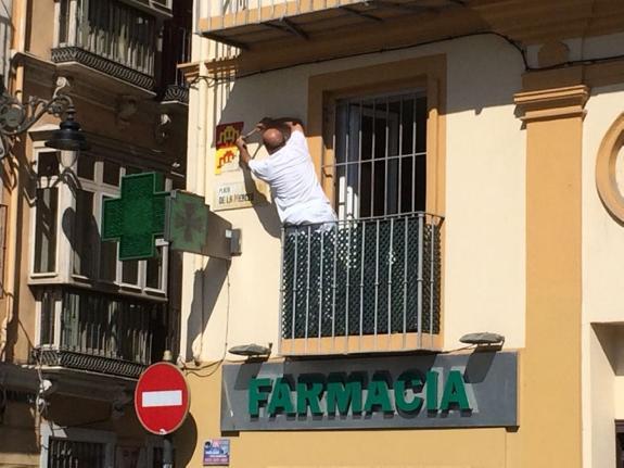 A mosaic comes down on the corner of Plaza Merced in Malaga's historic centre.