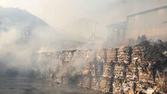 Smouldering cardboard at the recycling centre after the blaze.