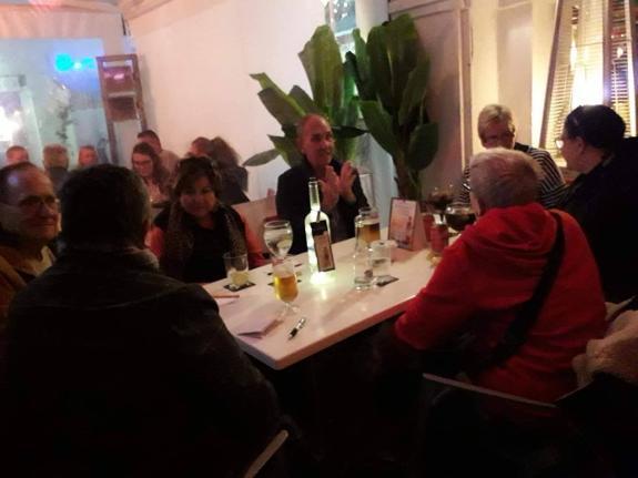 Customers study Spanish in the Manilva bar. 