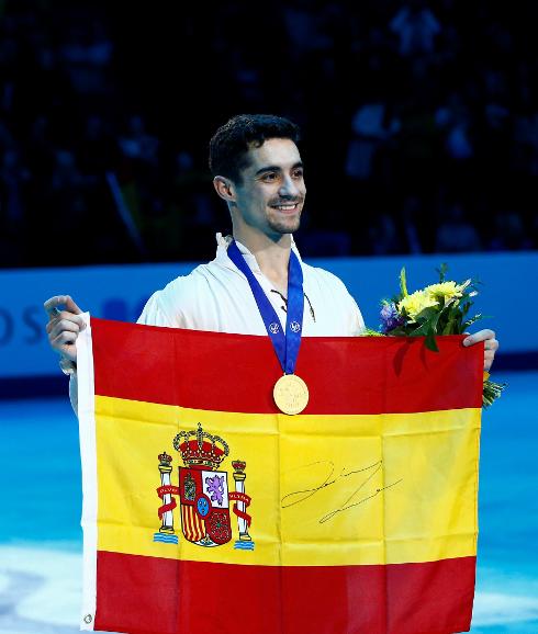 With his medal.