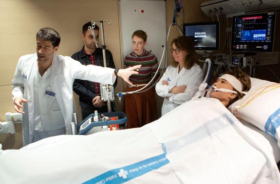 Audrey, in a striped sweater, listens as doctors at Vall d'Hebron hospital explain how she was kept alive.