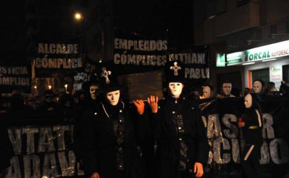 A mock funeral procession ended at the stadium. 