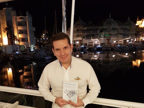 The poet with a copy of the book about his beloved Benalmádena.