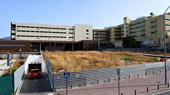 The unfinished building on the left, and the entrance to the car park. 