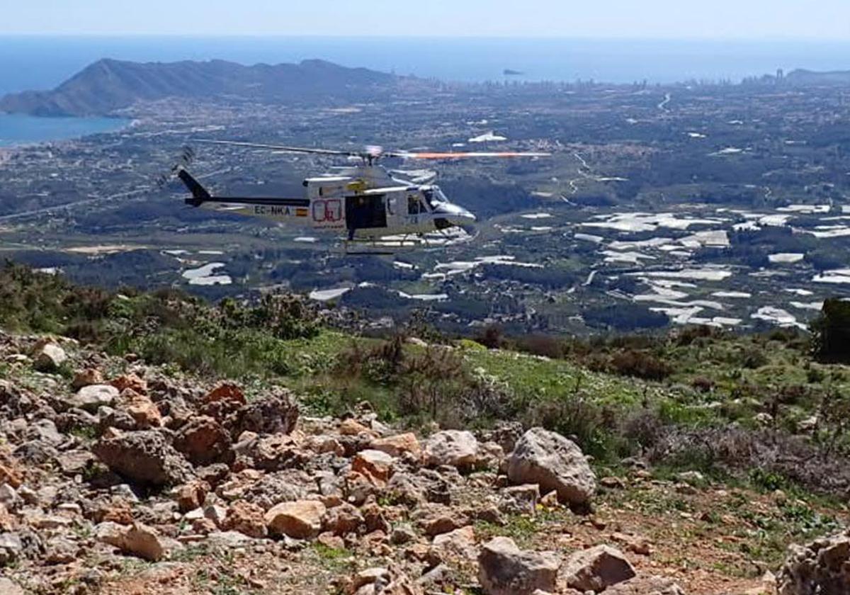 Helicopter performing rescue maneuvers.