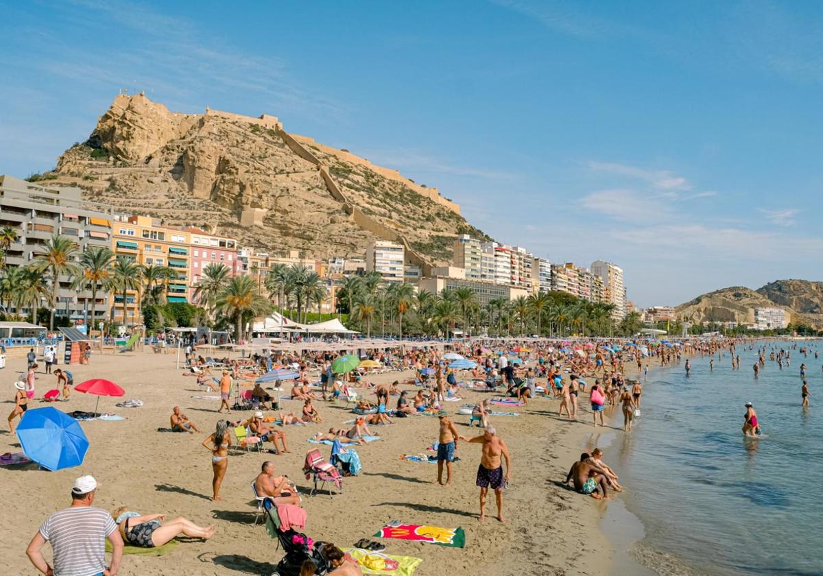 Beachgoers at Postiguet Beach in Alicante.