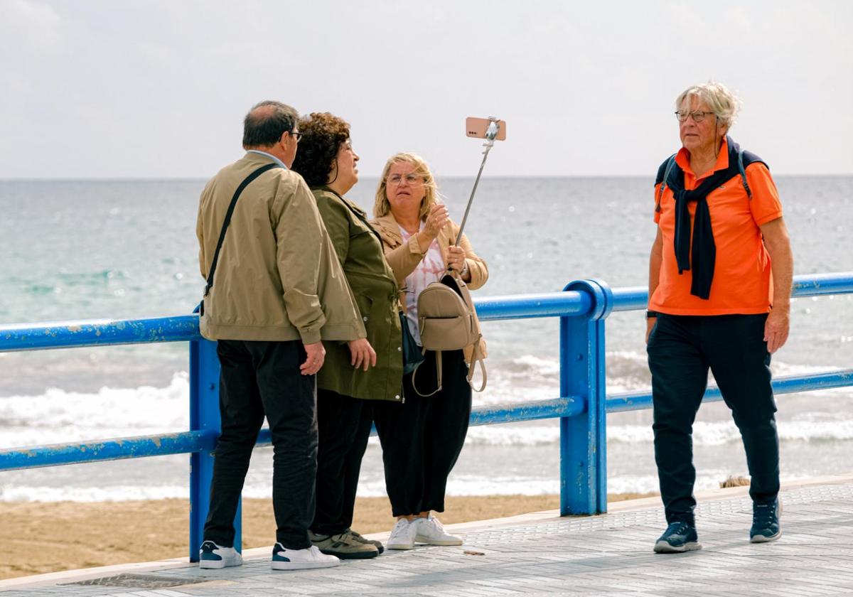 Tourists on the Postiguet beach in Alicante.
