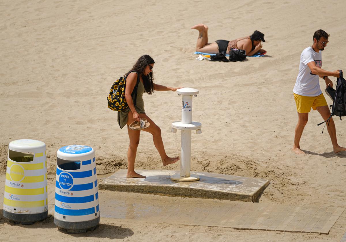 Beachgoers at Postiguet Beach in Alicante.