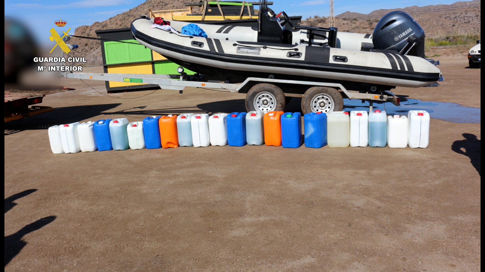 Boat and gasoline canisters seized in the operation.