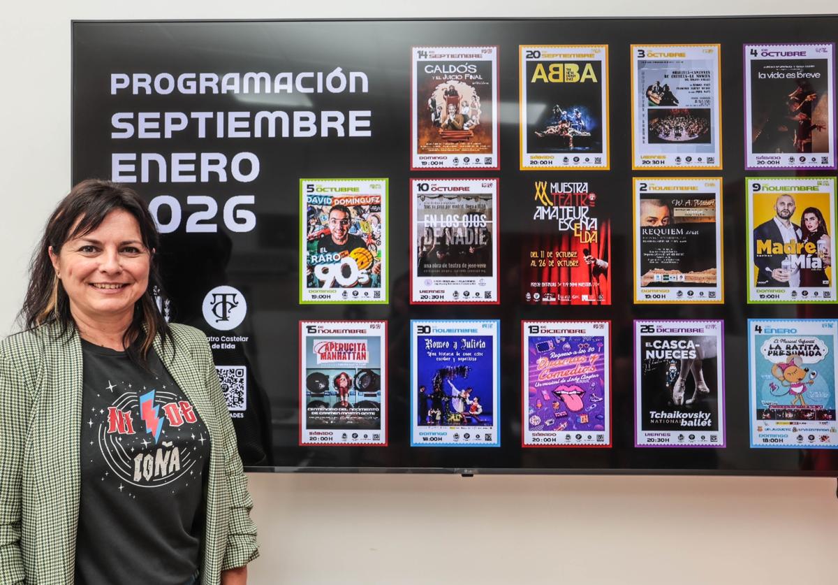 The councillor alongside the poster showcasing the second semester's programme.