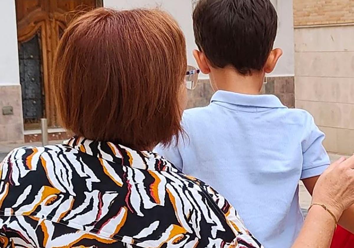 A grandmother with her grandchild, in an archive image.