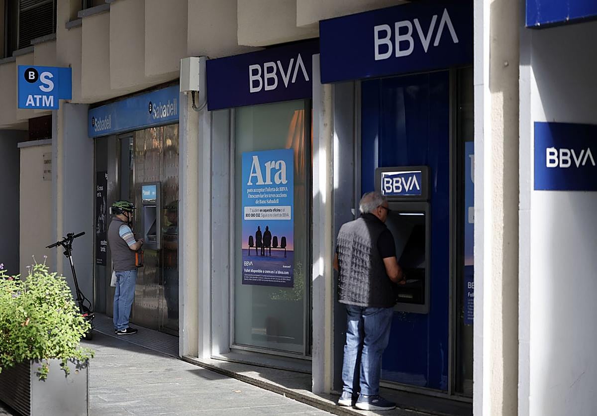 View of a Banco Sabadell office next to a BBVA office.