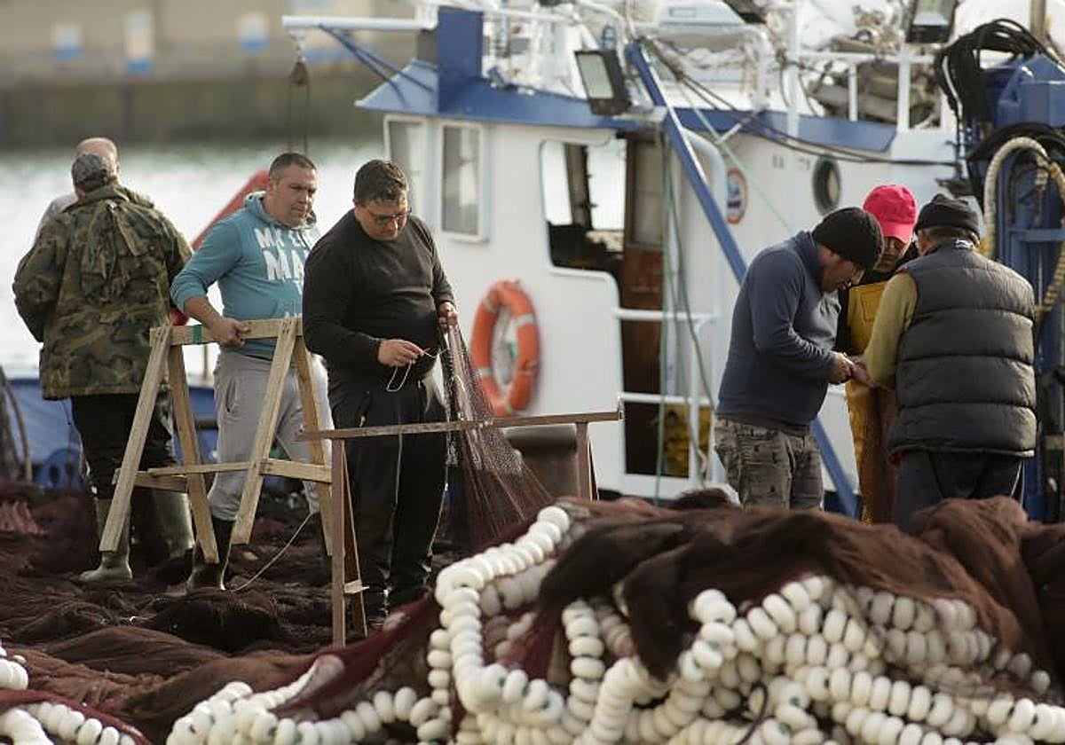 Fishermen on a boat, in an archive image.
