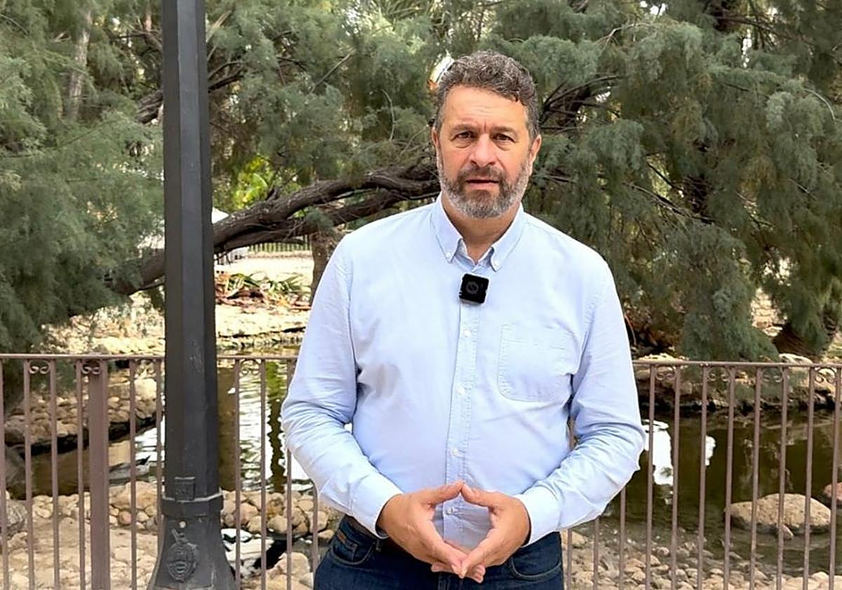 The Councillor for the Environment, José Antonio Román, in front of the fenced pond.