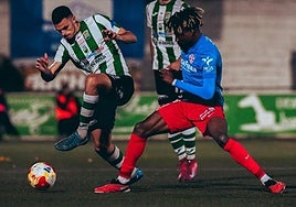 John contests a loose ball during the first half in San Marcos.