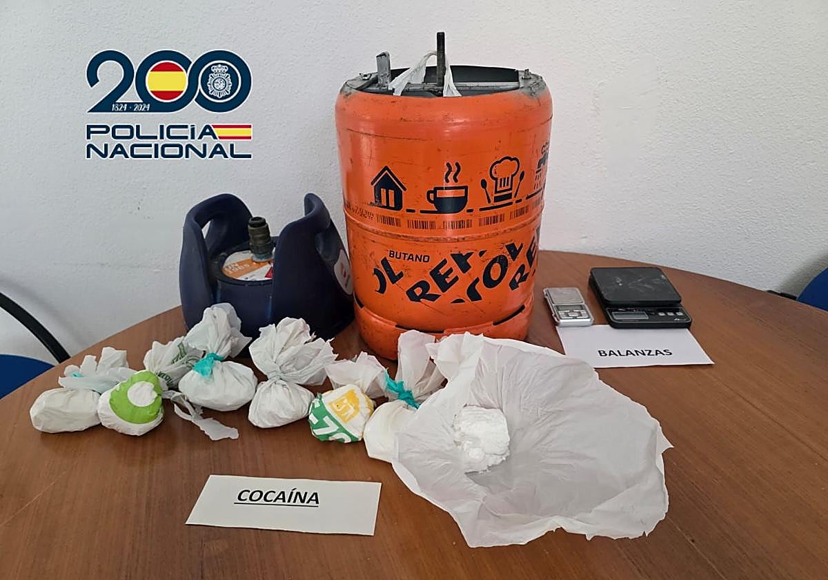 Seized items, including the gas cylinder where the drugs were hidden.